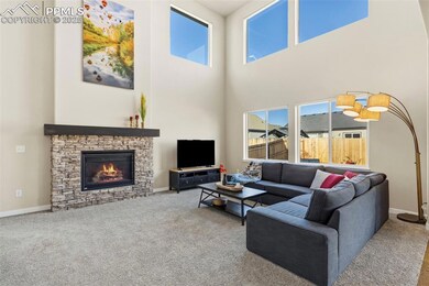 Great Room has Fireplace and Soaring Ceilings!