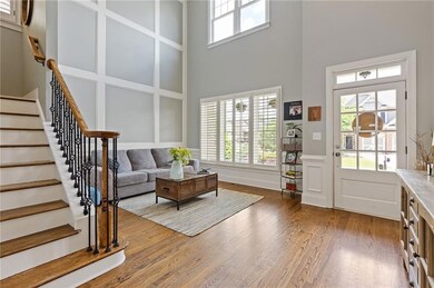 Rod iron spindles and hardwood flooring throughout