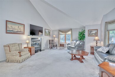 LIVING ROOM WITH CATHEDRAL CEILING & GAS FIREPLACE