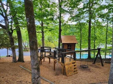 Treehouse in amenities area overlooking the lake