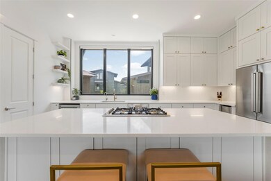 Kitchen featuring stainless steel appliances, a b