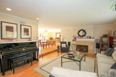 Beautiful living also has a fireplace & crown mold