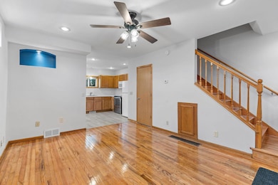 Open and bright main floor with beautifully refinished maple hardwoods!