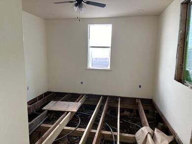 Unfurnished room featuring ceiling fan