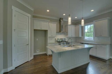 Custom cabinets with granite counter-tops and  large pantry, stainless steel appliances