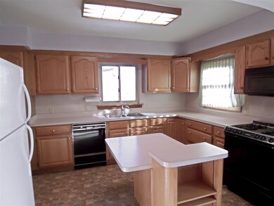 The fully applianced kitchen offers an abundance o