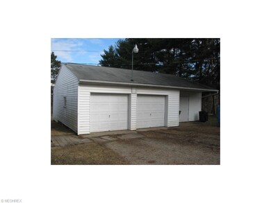 Two car detached garage with workshop area to the 
