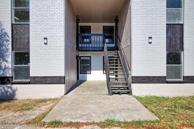 Entrance to property with brick siding