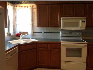 Kitchen features all appliances and skylight.