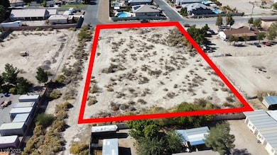 Aerial view of residential area with property parcel outlined