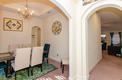 Tray ceiling in Dining Room and elegant chandelier