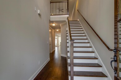 Two story Foyer w/ hardwood stairs