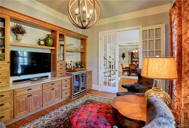 WORK AND PLAY! Custom home office w/bar and lounge