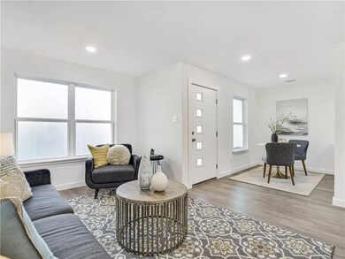 Living area featuring wood finished floors, baseb