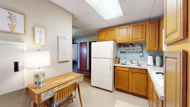 Kitchen with freestanding refrigerator, a paneled