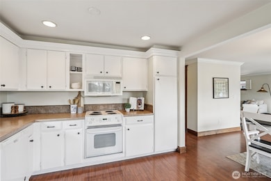 Large Open Kitchen with Hardwood Flooring