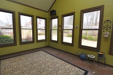 Relax in the large sunroom with vaulted ceilings, 