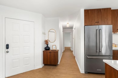 Kitchen featuring high quality fridge, light wood