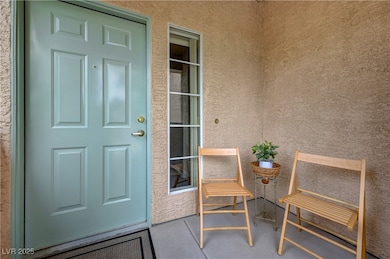 Property entrance with stucco siding