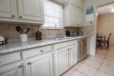 VIEW OF KITCHEN FROM DOOR LEADING OUT TO BACK YARD