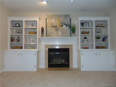 Gas fireplace with built-in bookshelves.