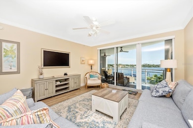 LIVING ROOM opens to LARGE BALCONY with water views and sunset views!