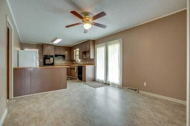 12x12 dining has room for a large table, hutch and more, French doors exit to patio