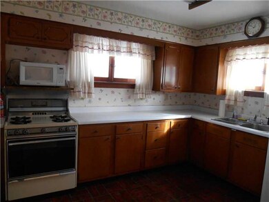 Kitchen. There is an exit door from the hallway by