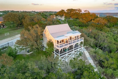 Aerial view of property and surrounding area with