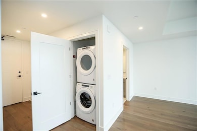 Laundry area with stacked washer and dryer, recess