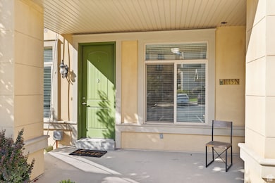 View of exterior entry with a porch
