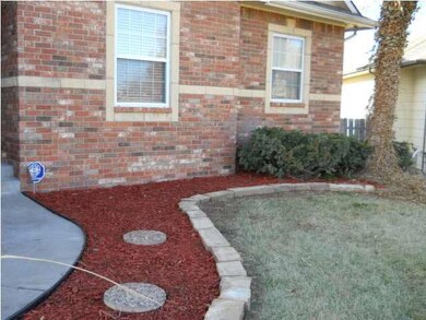 Brick front, plus stone accent around windows.