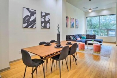 Dining area featuring ceiling fan and light wood-t