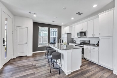 Kitchen with appliances with stainless steel finis