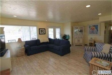 Another view of the spacious living room and entry