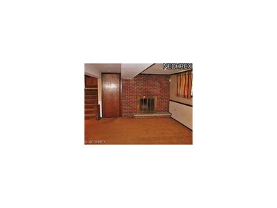 Family room w/ wood burning FP.