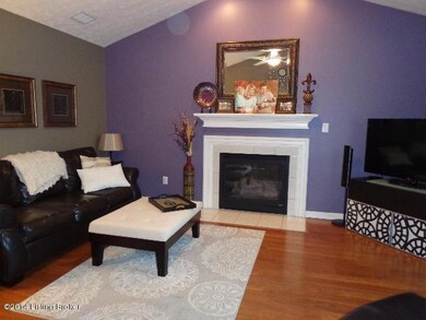 familyroom w fireplace & vaulted ceiling