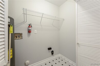 Washroom featuring laundry area, tile patterned fl