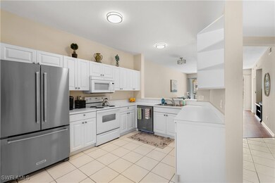 Kitchen featuring light tile