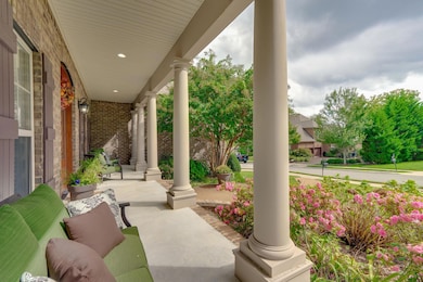 Southern style rocking chair front porch with beautiful landscaping