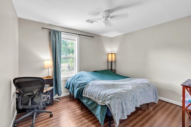Bedroom with hardwood / wood-style floors and ceil