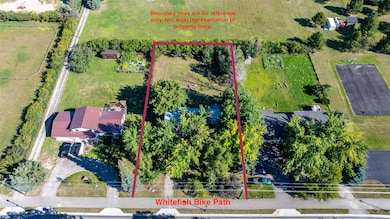 Subdividable 1/2 acre lot with 2800sqft residence walkable to downtown Whitefish!