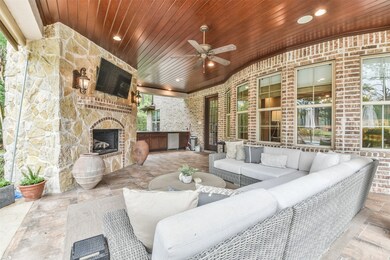 Gorgeous outdoor living space! Outdoor fireplace , Mosquito mist system! Ceiling fan, Wood Ceiling treatment!