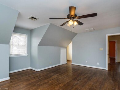 The master bedroom offers of ton of natural light. Notice the entrance to the dormer.