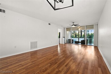 Unfurnished living room featuring hardwood / wood-