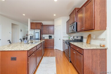 Kitchen with light hardwood / wood-style flooring,