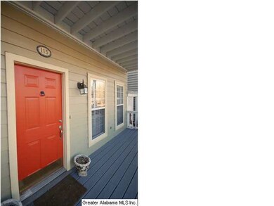 Front porch with Red Accent Door leading you into 