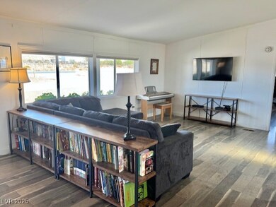 Living room with wood-type flooring