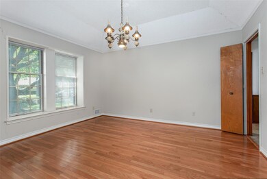 Formal Dining Room with laminate flooring.
