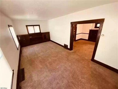 Unfurnished room featuring carpet